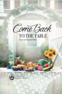 cookbook cover with flowers and food